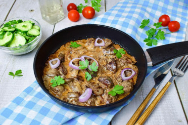 Chicken liver in a frying pan with mayonnaise