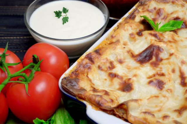 Lasagna with minced meat, tomato paste and bechamel sauce