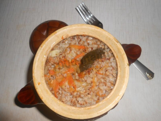 Buckwheat porridge in a pot in the oven with meat