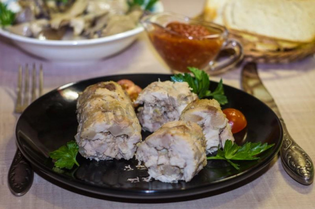 Pork sausage with chicken fillet in foil in the oven