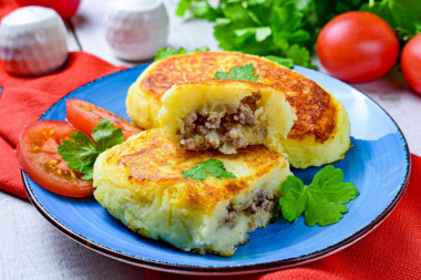 Pies from mashed potatoes in a frying pan