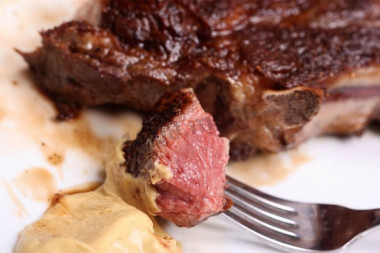 Veal steak in a frying pan