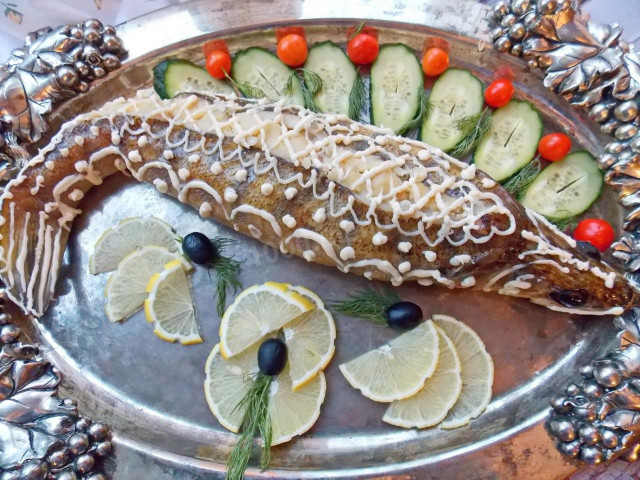 Whole stuffed pike perch in the oven