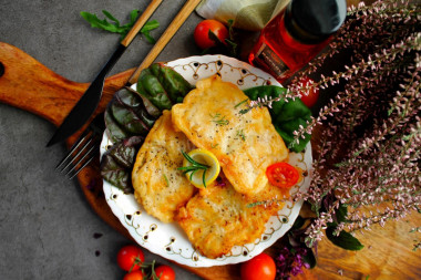 Pangasius in batter in a frying pan