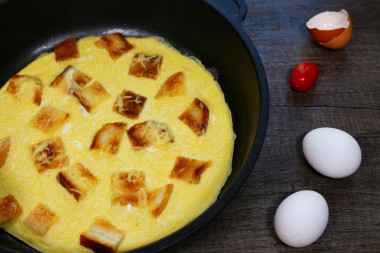 Omelet with bread in a pan