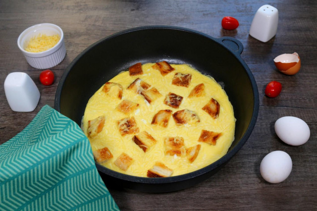 Omelet with bread in a pan