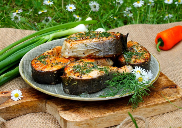 Salmon on coals on a grill