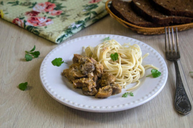 Meat with mushrooms in a slow cooker