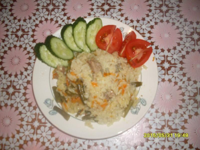 Rice with meat and vegetables in a slow cooker