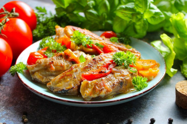 Delicious pork ribs in a frying pan stewed with vegetables