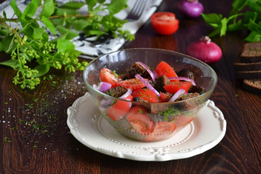 Salad with black bread and tomatoes