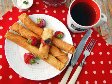 Thin grandmother's pancakes with milk