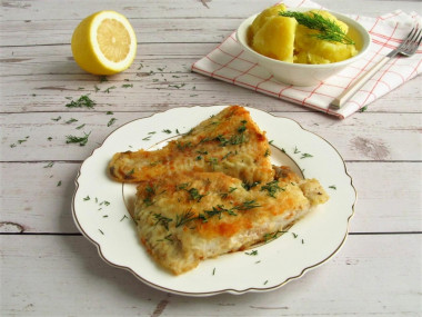 Flounder in flour in a frying pan