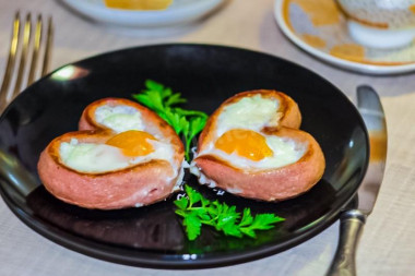 Fried eggs with a heart and sausage