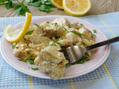 Fish stewed in sour cream with onions