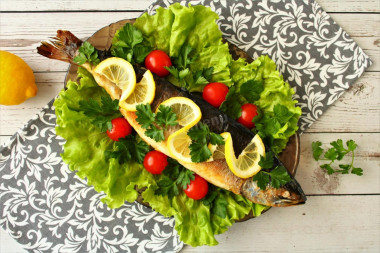 Stuffed salmon baked in the oven whole