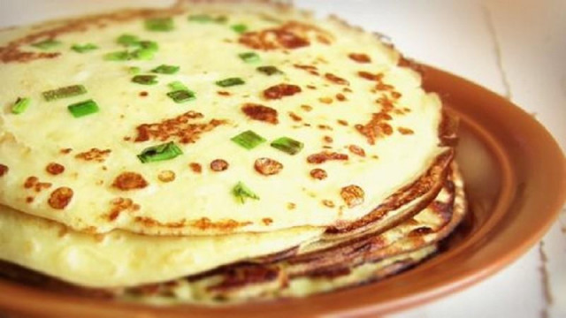 Pancakes made from boiled potatoes in milk with green onions
