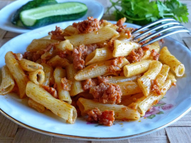 Pasta with turmeric and minced meat in a frying pan