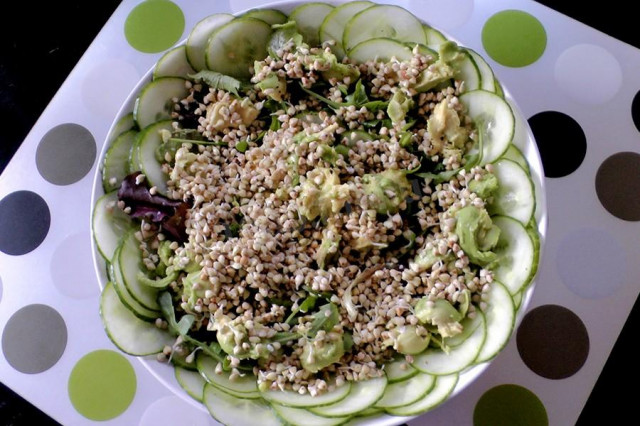 Salad with avocado cucumber and sprouted buckwheat