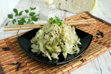 White cabbage with sesame seeds in a frying pan