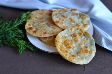 Tortillas with dill in a frying pan