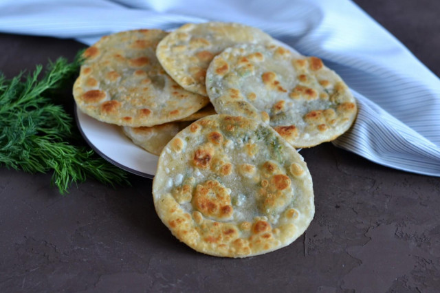 Tortillas with dill in a frying pan