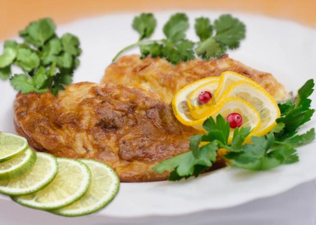 Pike perch in flour in olive oil in a frying pan