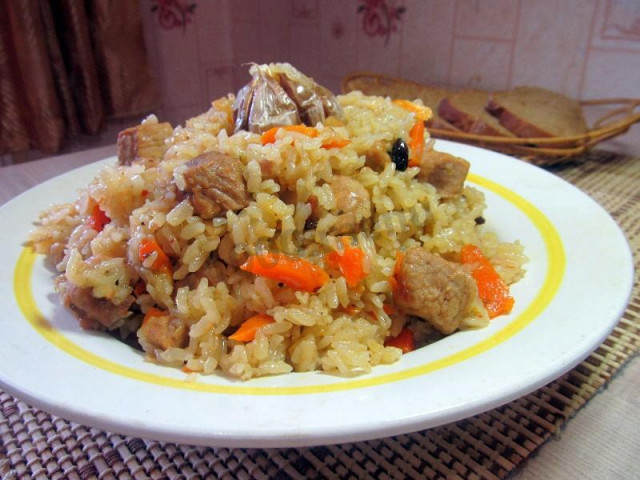 Pork pilaf with onions in a slow cooker