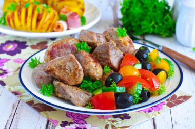 Pork shish kebab in a frying pan