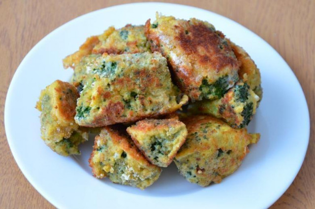 Fresh broccoli in a frying pan in egg and breadcrumbs from a loaf