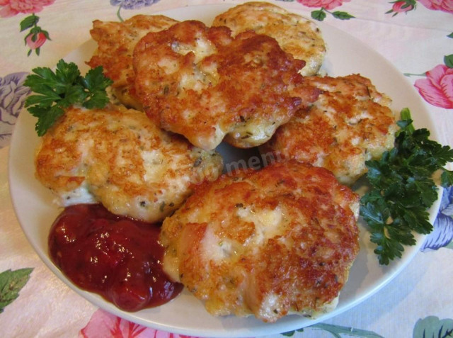 Chicken cutlets with hard cheese and garlic