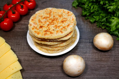 Cheese tortillas with milk in a frying pan