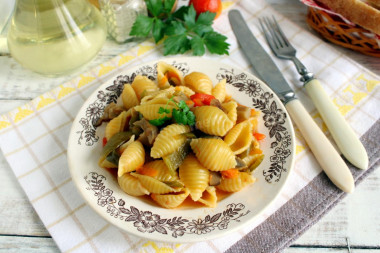 Pasta with mushrooms and vegetables in a frying pan