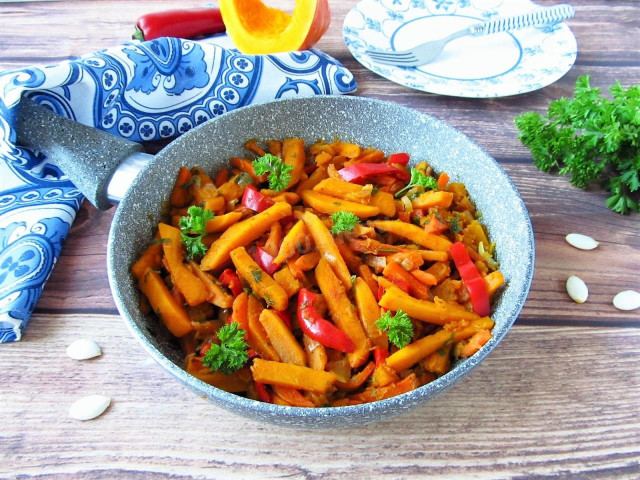 Pumpkin in a frying pan with vegetables