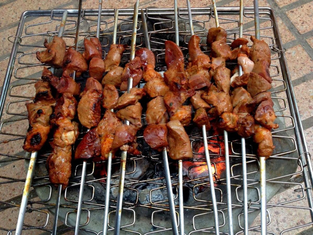 Lamb kebab liver on a grill on coals