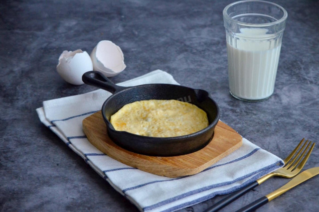 A simple omelet of eggs and milk in butter