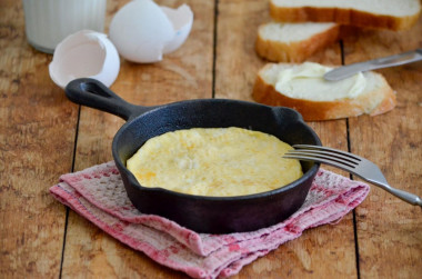 A simple omelet of eggs and milk in butter