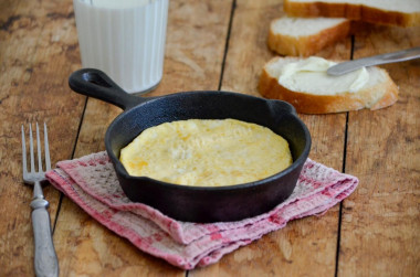 A simple omelet of eggs and milk in butter