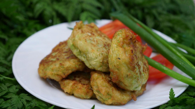 Pancakes from young zucchini with onions