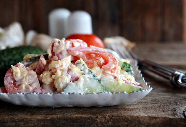 Tomato salad with cucumbers and cheese