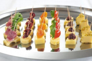 Simple canapes with salmon, lemon and cheese
