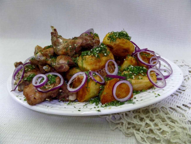 Fried rabbit with potatoes and herbs