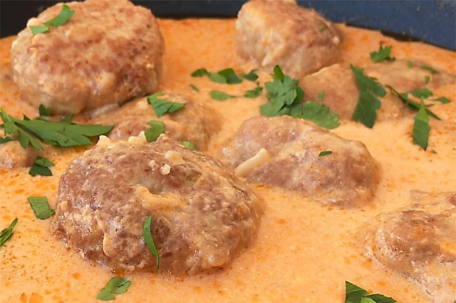 Beef meatballs with tomato and sour cream sauce on sour cream