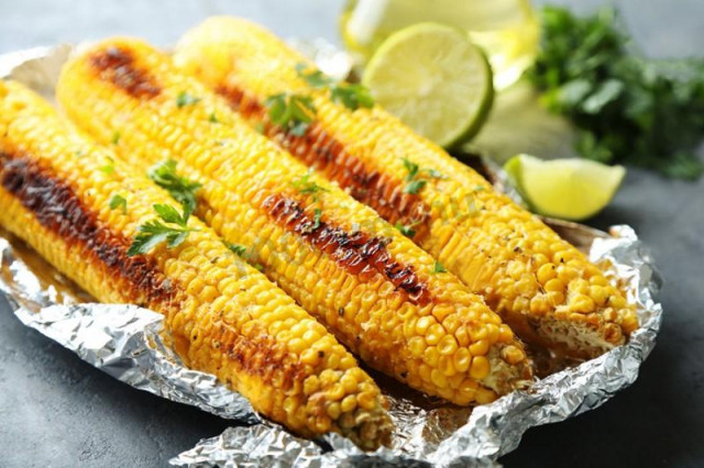 Corn baked in foil on the grill