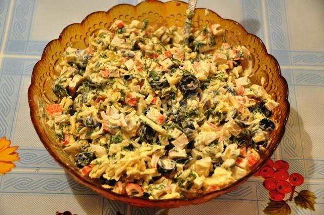 Crab salad with cheese and olives