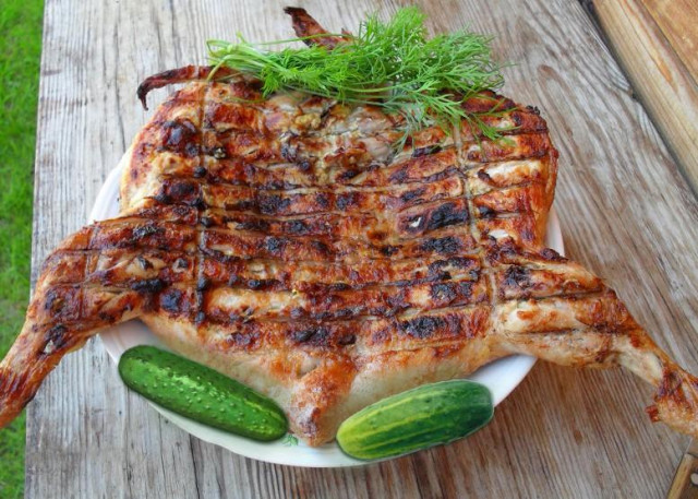 Barbecue chicken on the grill with beer