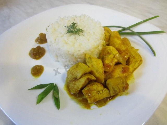 Delicious chicken in curry sauce with garlic