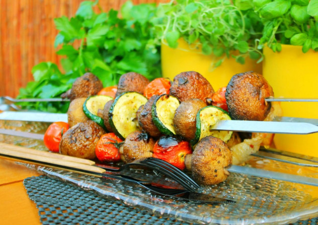 Shish kebab of mushrooms on the grill