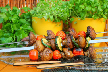 Shish kebab of mushrooms on the grill