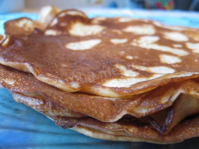 Pancakes on ryazhenka with eggs and soda
